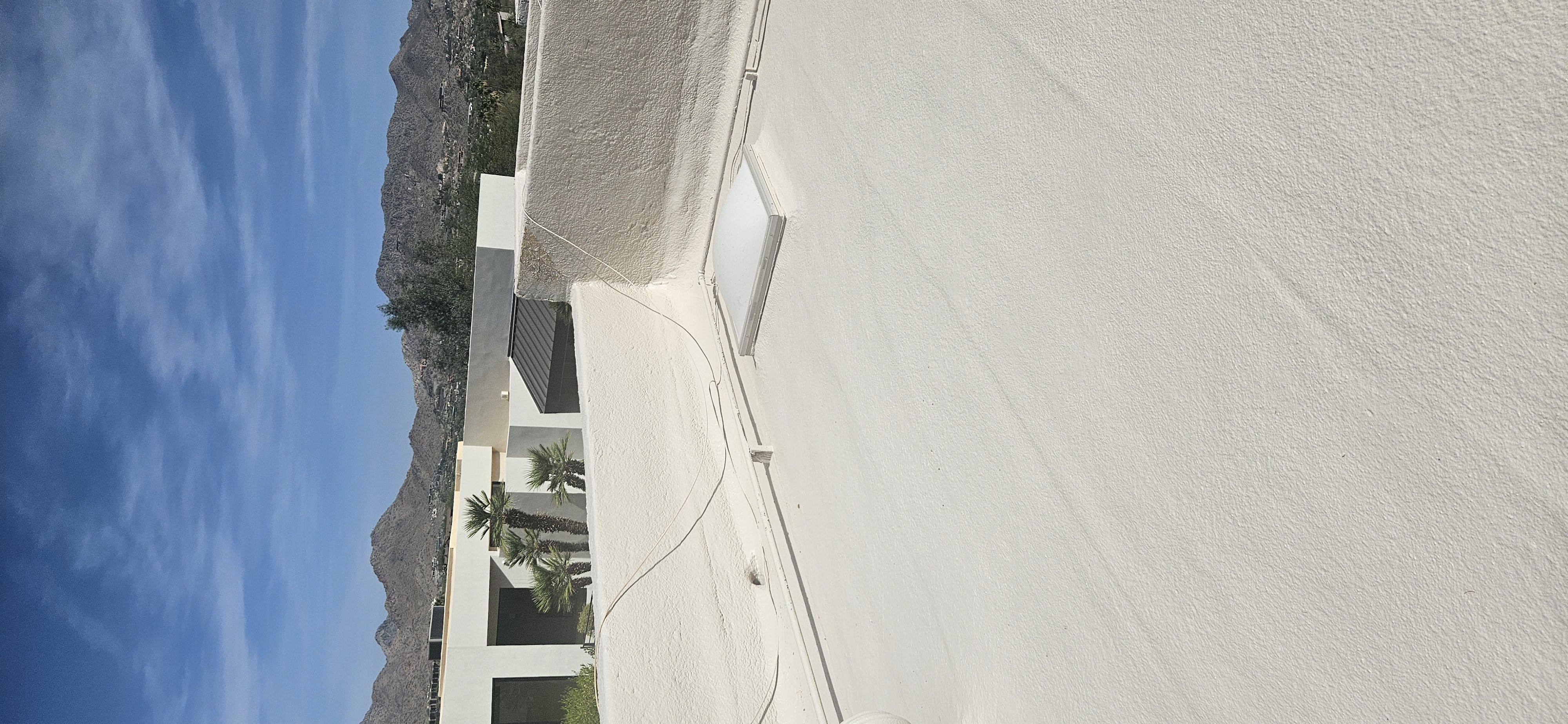 Newly installed foam roof on a flat-roof structure in Paradise Valley — the same insulation system used on garages.