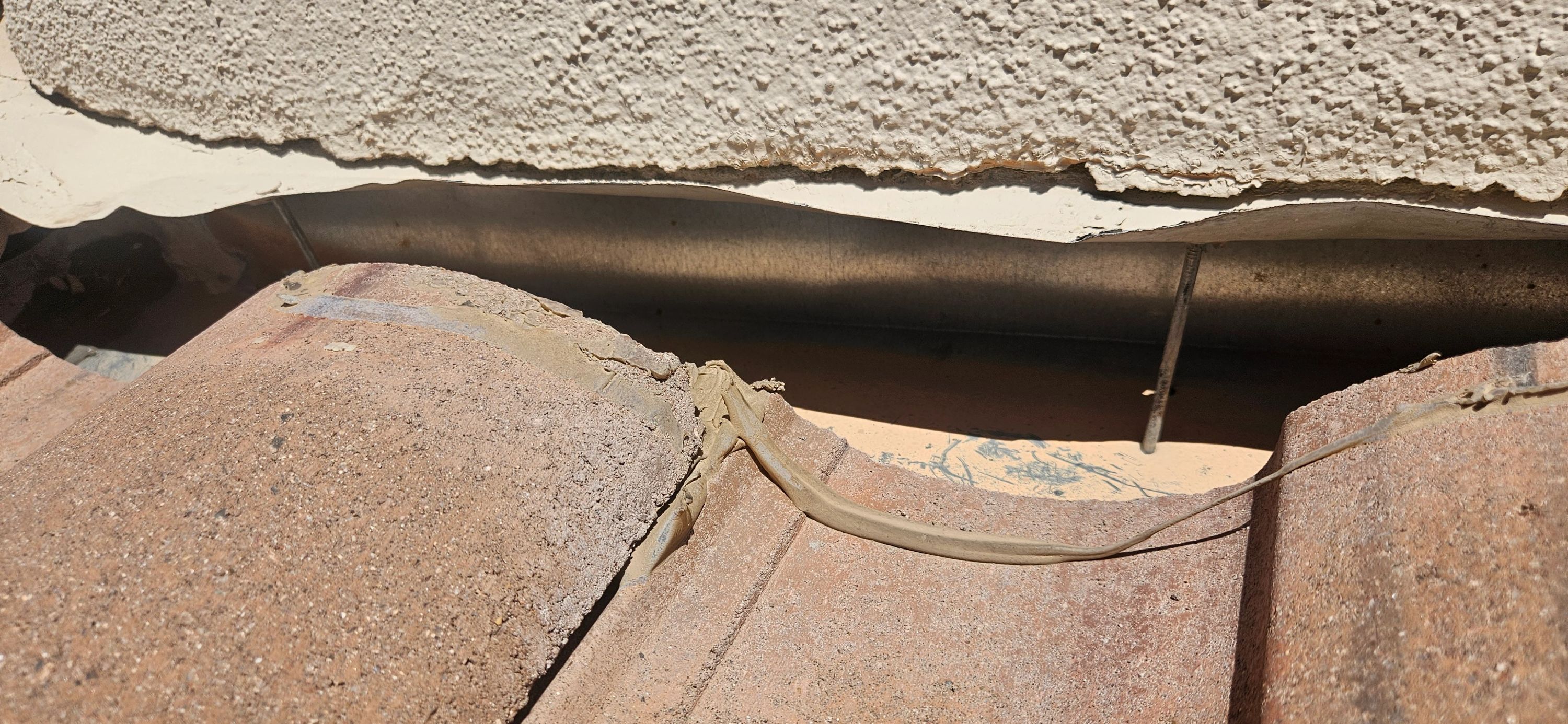 Tile roof damage needing repair, Durafoam Roofing offers free roof inspections in Phoenix.