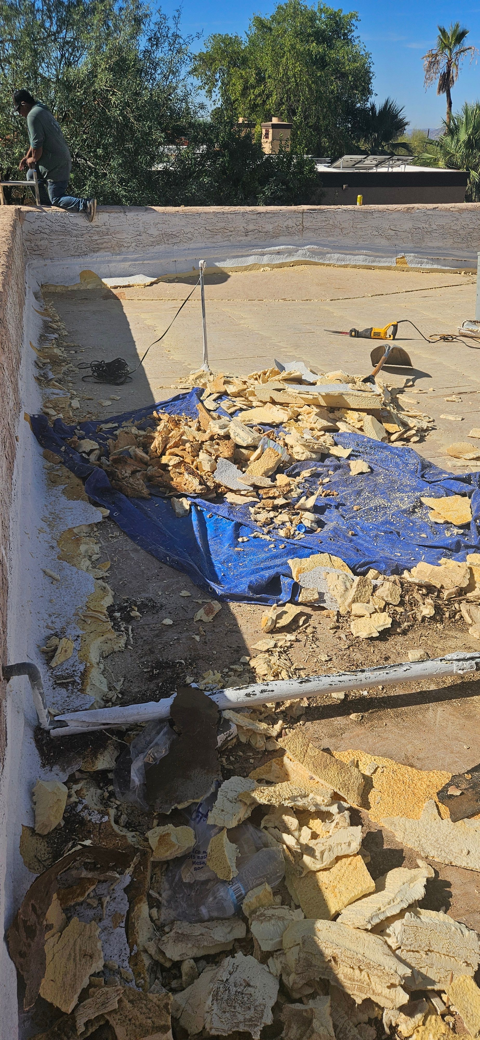 Durafoam crew removing an old flat roof during a Phoenix roof replacement