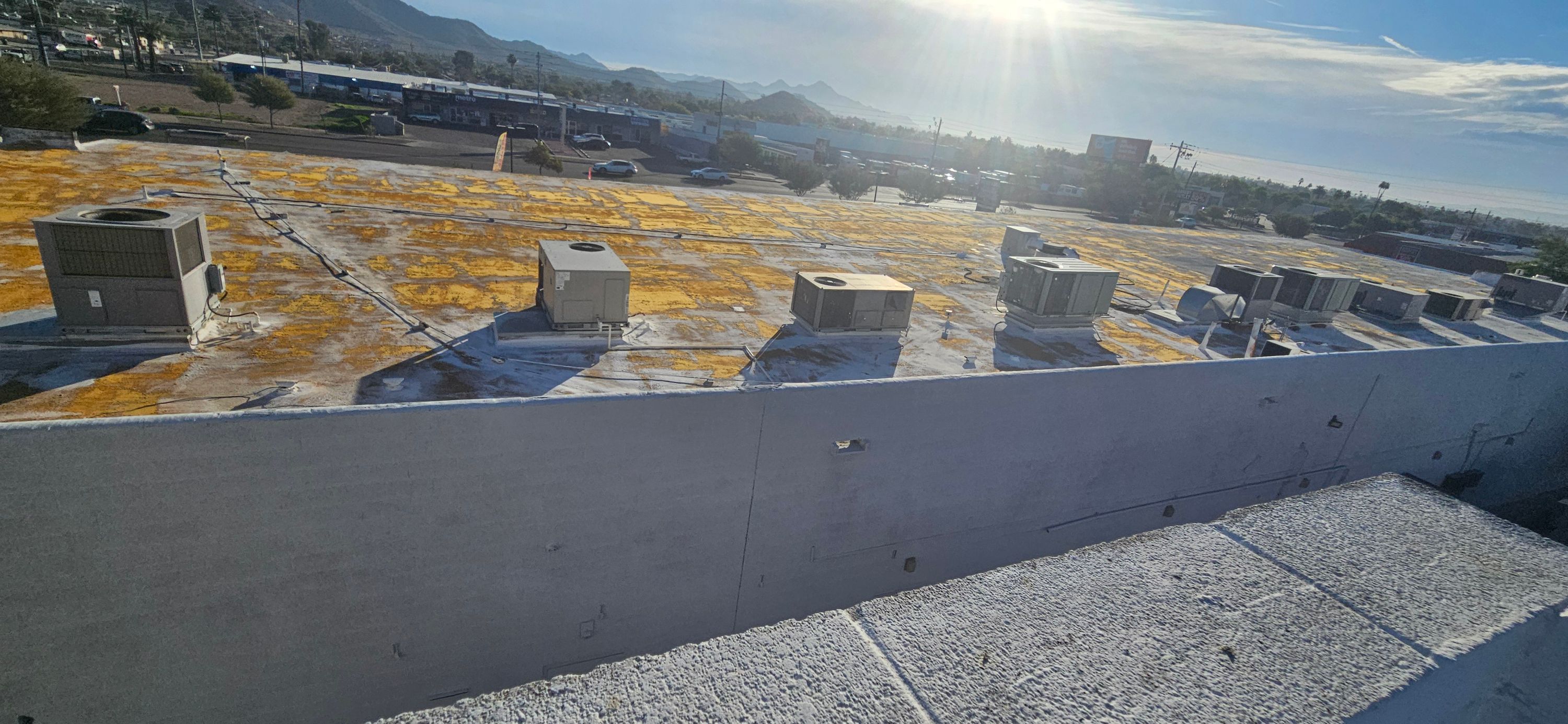 Commercial roof repair underway on a Phoenix building