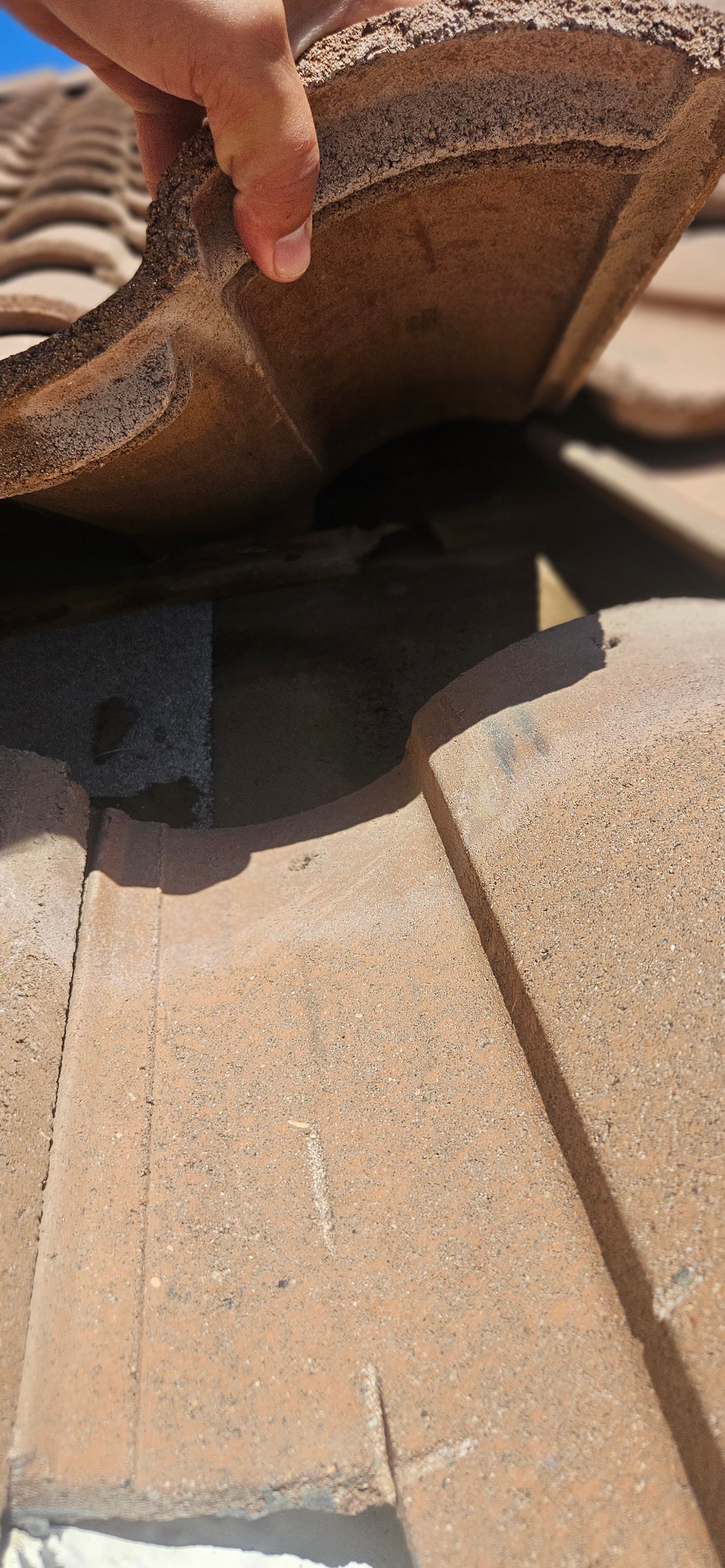 Emergency roof leak repair during monsoon season in Phoenix.