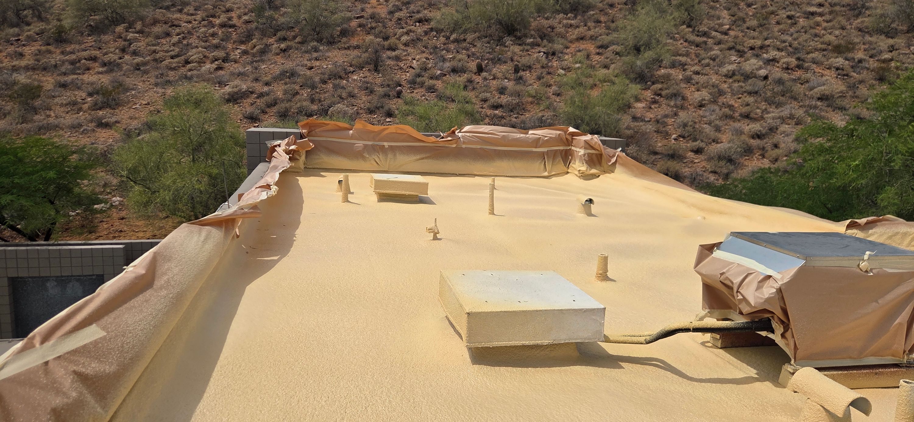 Durafoam crew repairing storm damage on a Phoenix roof