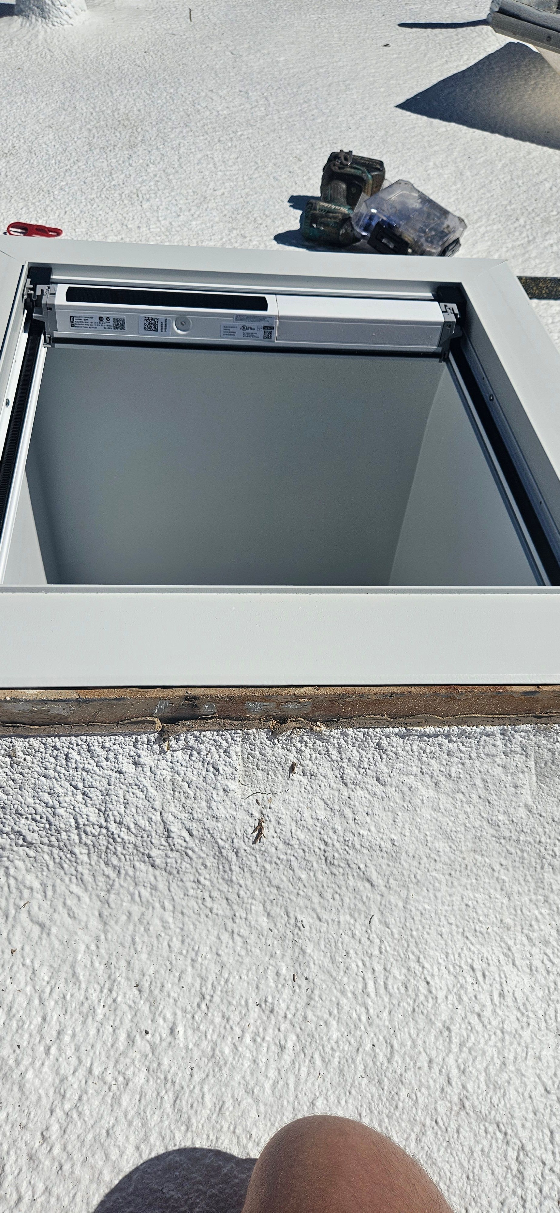 Phoenix skylight repair on a foam, flat roof detail by Durafoam Roofing.